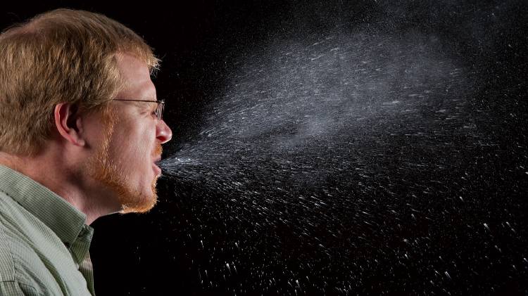 Person sneezing, photo credit: CDC